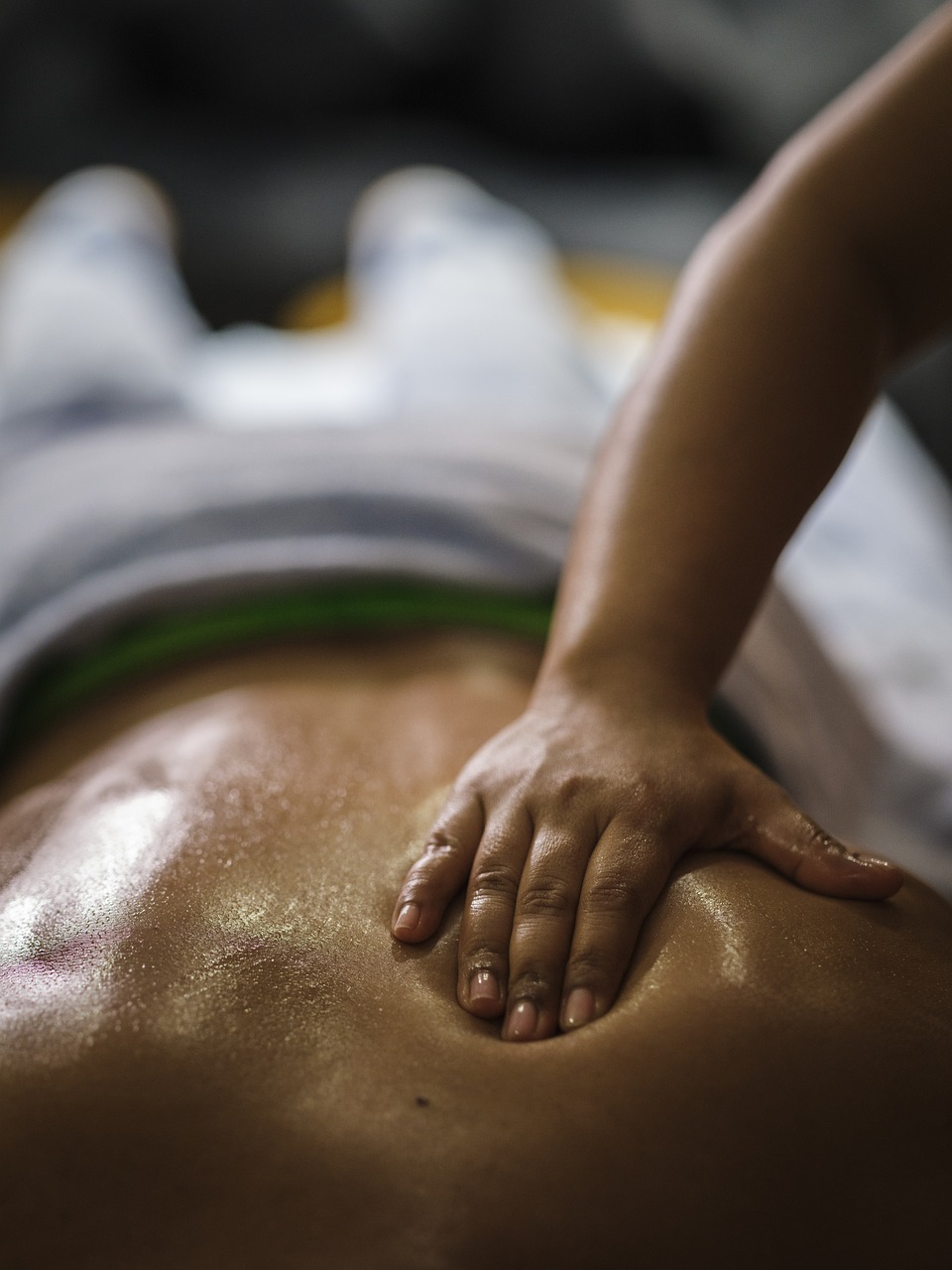 Certified massage therapist providing therapeutic massage for pain relief in Millwoods, Edmonton.